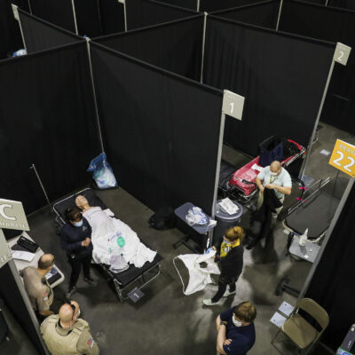 WORCESTER - 4/7/2020:   A simulation is set up in a makeshift hospital room to properly train paramedics as UMass Memorial Health helps to prepare the first field hospital in the state of Massachusetts.  The field hospital has been built at the DCU Center in downtown Worcester as the state prepares for an expected surge in coronavirus patients. UMass Memorial Health Care will operate the pop-up hospital, which is the first one of three that the state is planning to open. The facility is expected to open Thursday, April 9. (Erin Clark/Globe Staff)